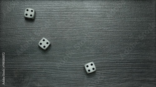 Poker Dice rolling three of a kind on four