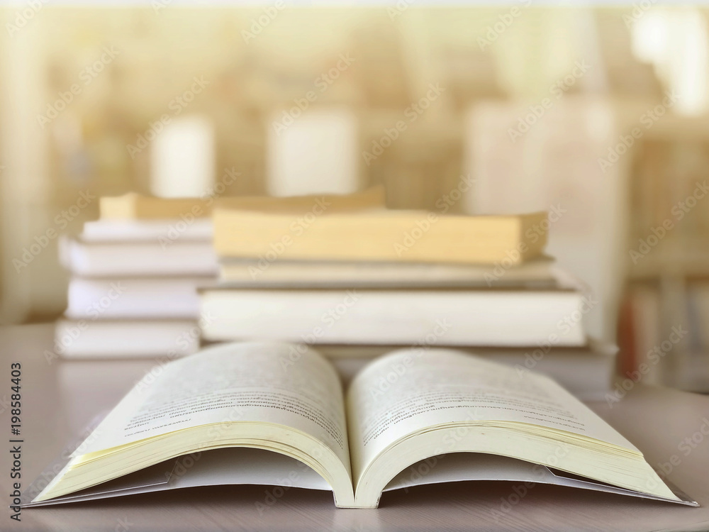 Open books on desk in the library. Education background Open books on desk in the library. Education background