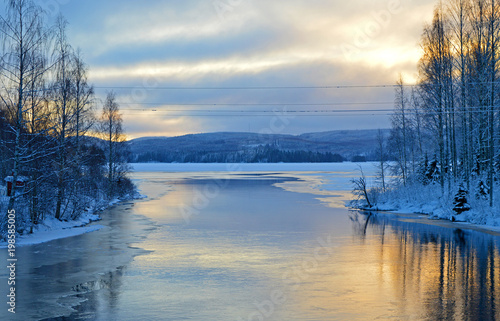 December dusk by the open water