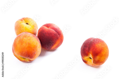 Group of ripe peach fruit isolated on white background.