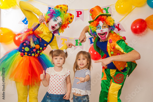 clown girl and clown boy at the birthday of a child. Party for children. Play and entertain boys and girls