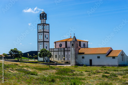 Sand dunes and Church at Costa Nova, a famous beach near Aveiro, Centro, Portugal