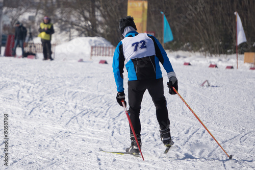 closeup of a male athlete skier during the race Les classic style in the championship . photo