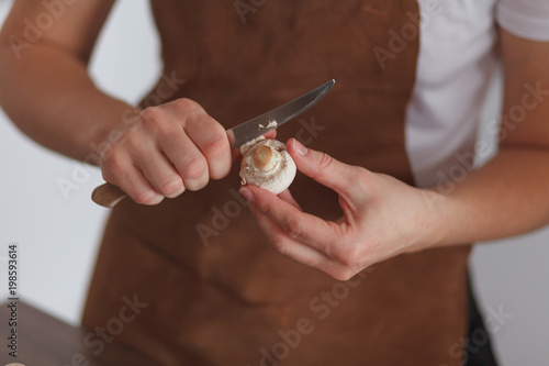 Woman peelin champignon photo