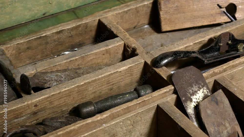 Panning view over old tools in chest showing files and plainer. Panning view over old tools in chest showing files and plainer.
