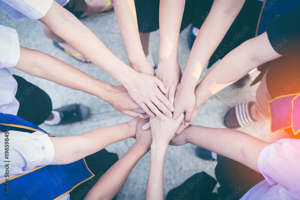 Close up of high hand gesture, symbol of common celebration or greeting, people planning to reach their goal, slap each other to start working together. Success and teamwork concept Close up of high hand gesture, symbol of common celebration or greeting, people planning to reach their goal, slap each other to start working together. Success and teamwork concept