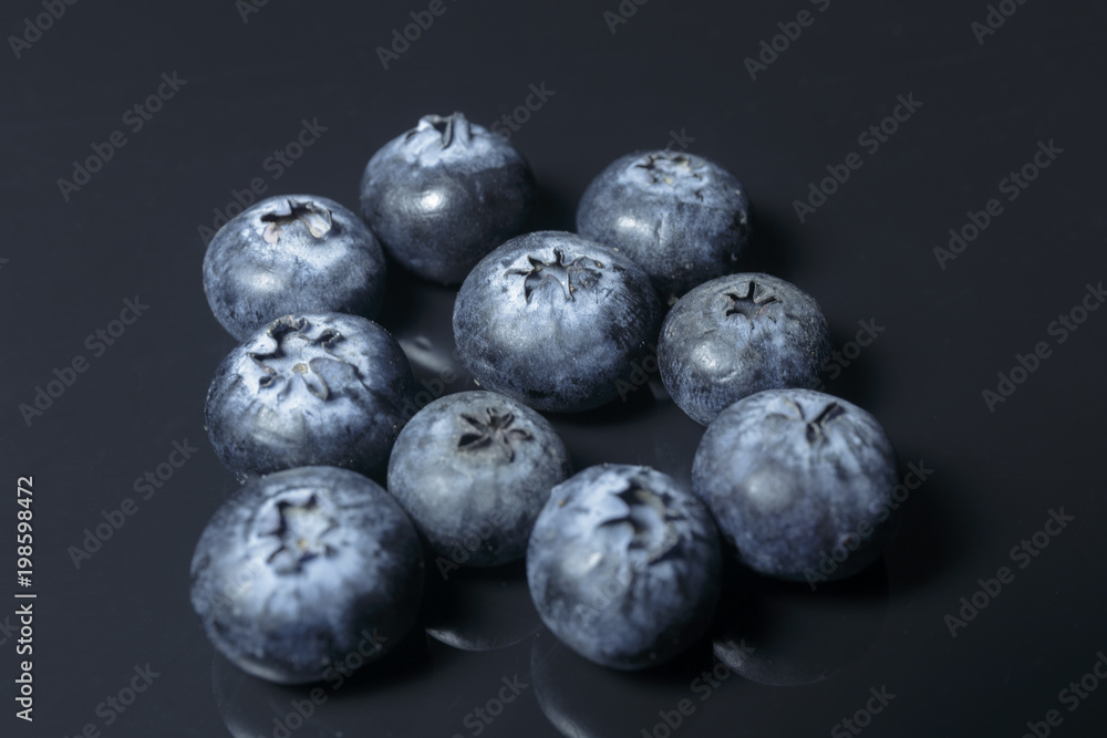 Blueberry closeup isolated on a dark background, Ready to Eat, Vegan food. Blueberry closeup isolated on a dark background, Ready to Eat, Vegan food.