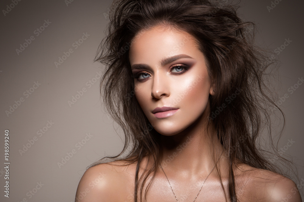 Fototapeta premium Beautiful woman with professional make up and hairstyle