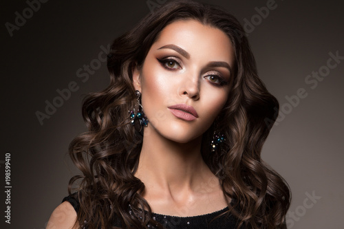 Beautiful young brunette with bright make up