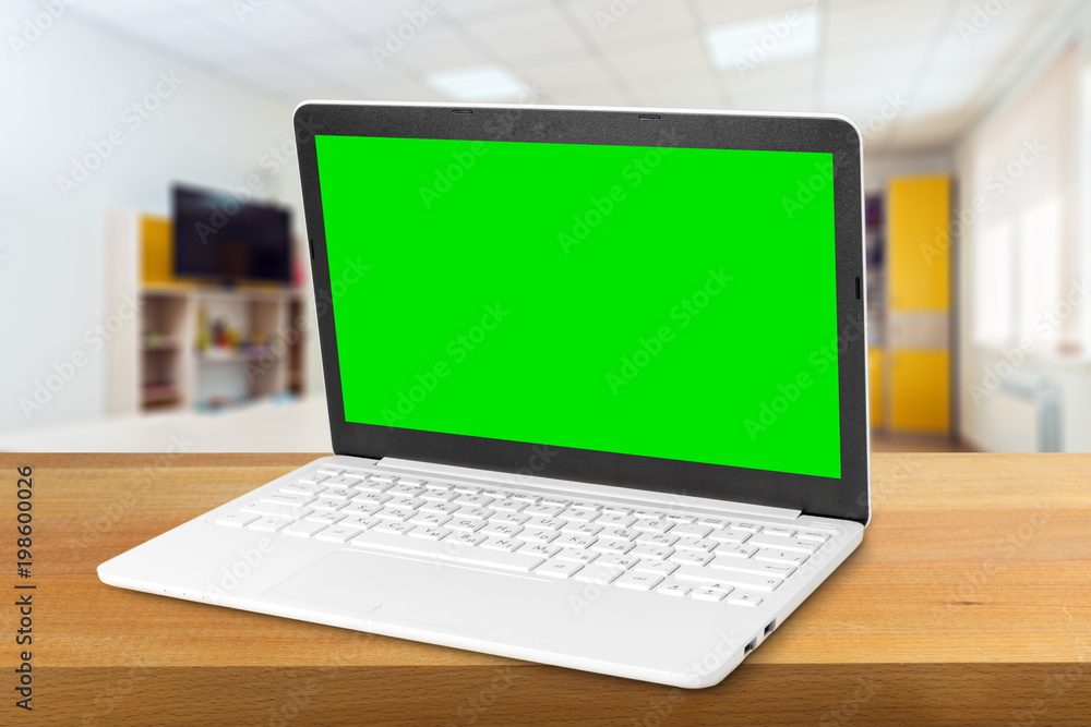 Laptop with blank screen on table Laptop with blank screen on table