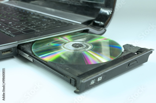 insert a CD into the laptop