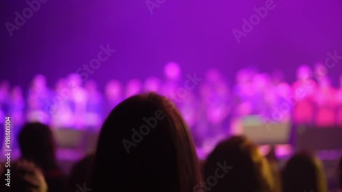 People applausing at the concert in club silhouette photo