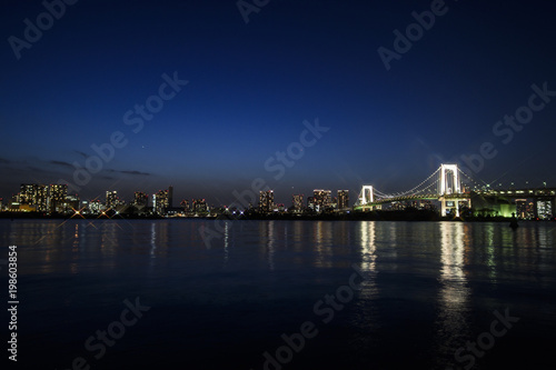 Tokyo Bay with Rainbow Bridge in Background at Dusk