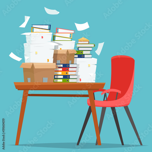Pile of paper documents and file folders in carton boxes on office table.