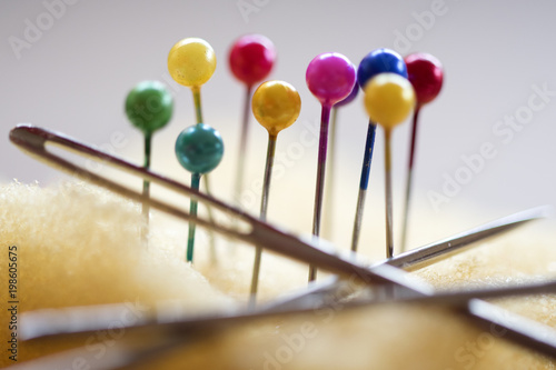colored head pins and darning-needles