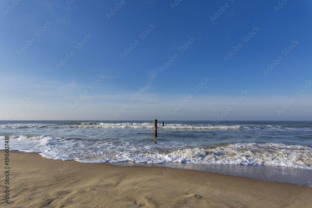 Strong wind with waves and whitecaps on the beach in Domburg / Netherlands