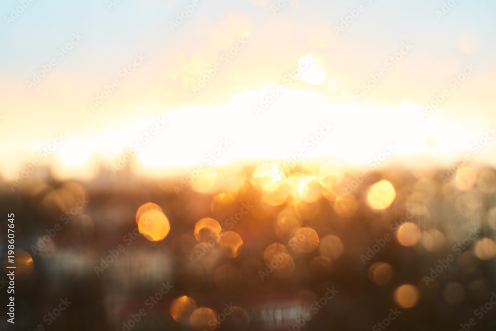 Rain drops texture on window glass with gorgeous vintage orange amber sunset light abstract blurred cityscape skyline bokeh background. Soft focus. Rain drops texture on window glass with gorgeous vintage orange amber sunset light abstract blurred cityscape skyline bokeh background. Soft focus.