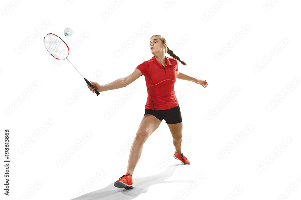 Young woman playing badminton over white background Young woman playing badminton over white background