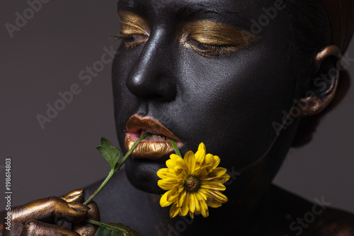 Portrait of a beautiful girl with a creative make-up, close-up.
