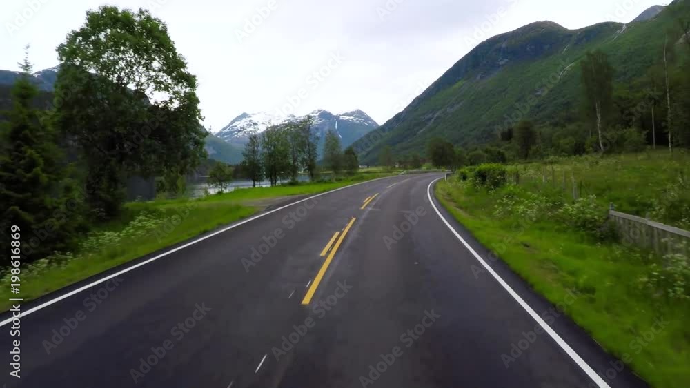 Driving a Car on a Road in Norway Driving a Car on a Road in Norway