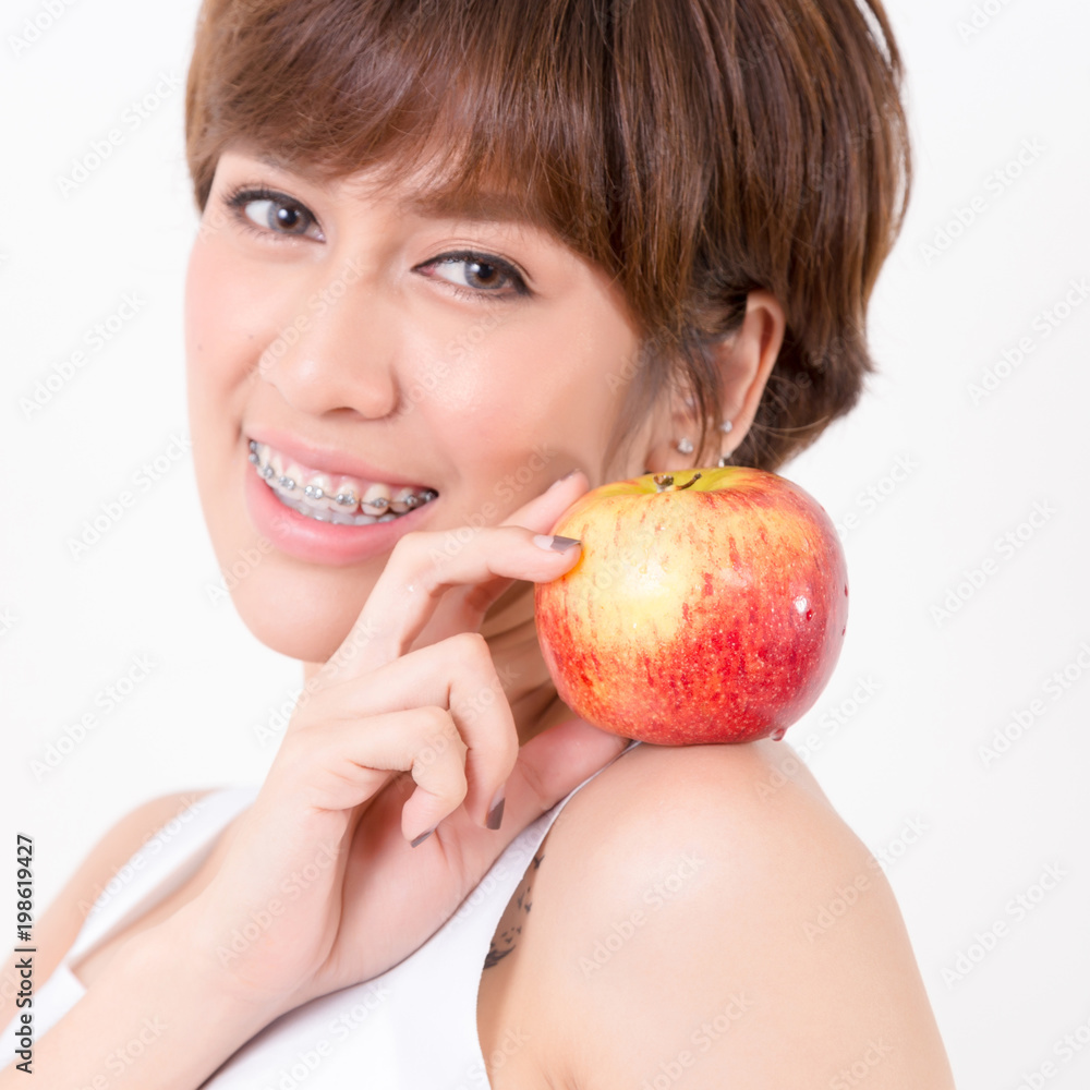 Beautifulyoung Asia woman with healthy food. Isolated on white background. Studio lighting. Concept for healthy. Beautifulyoung Asia woman with healthy food. Isolated on white background. Studio lighting. Concept for healthy.