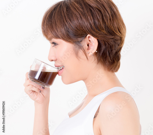 Beautifulyoung Asia woman with a cup of hot coffee. Isolated on white background. Studio lighting. Concept for healthy.