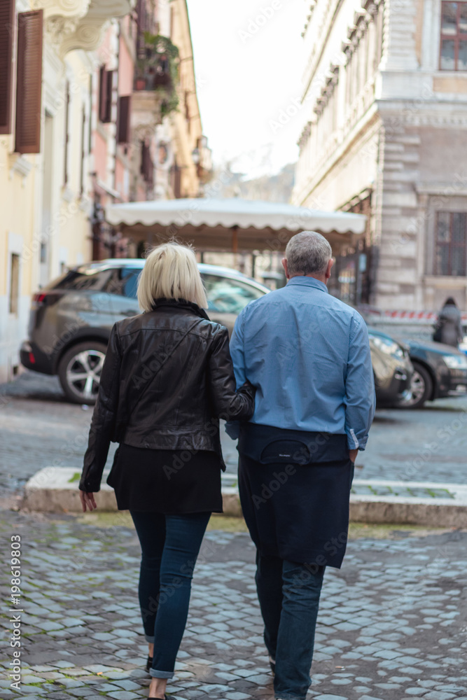 couple walking down the street romantic