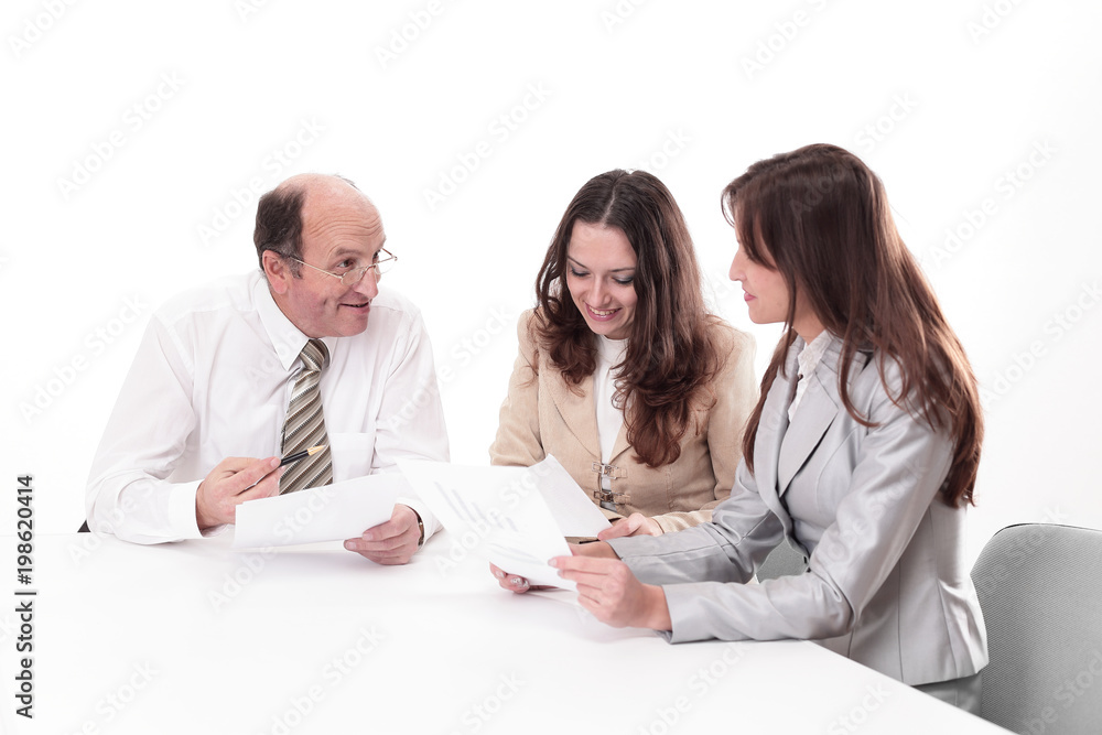 business team discussing a working paper business team discussing a working paper