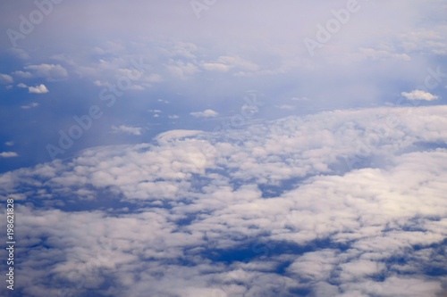 Fototapeta Naklejka Na Ścianę i Meble -  White clouds, view from above air plane window