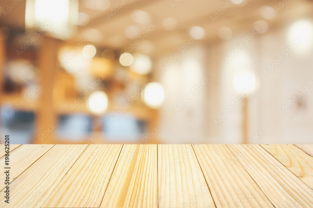 wood table with abstract blurred cafe restaurant with bokeh lights defocused background wood table with abstract blurred cafe restaurant with bokeh lights defocused background