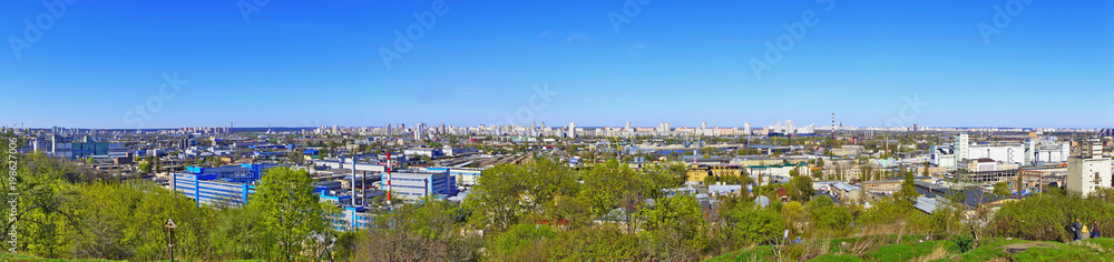Panoramic view to Kiev, Kyiv, Ukraine. Tatarka district, industrial zone buildings, sunny spring day 