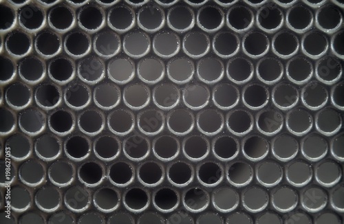 Texture background of an old speaker grille