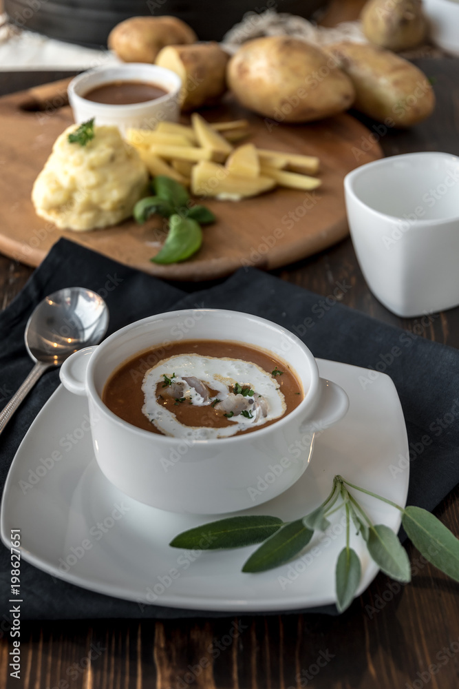 Vegetable cream soup with shrimps in bowl on table Vegetable cream soup with shrimps in bowl on table