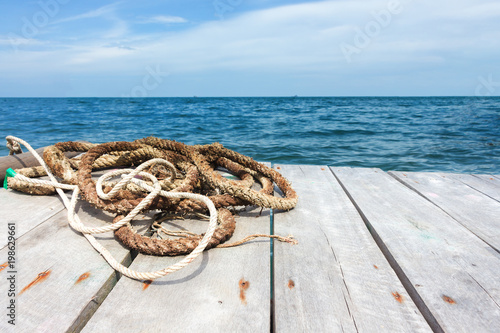 Canvas Print Perspective of wood terrace against beautiful seascape
