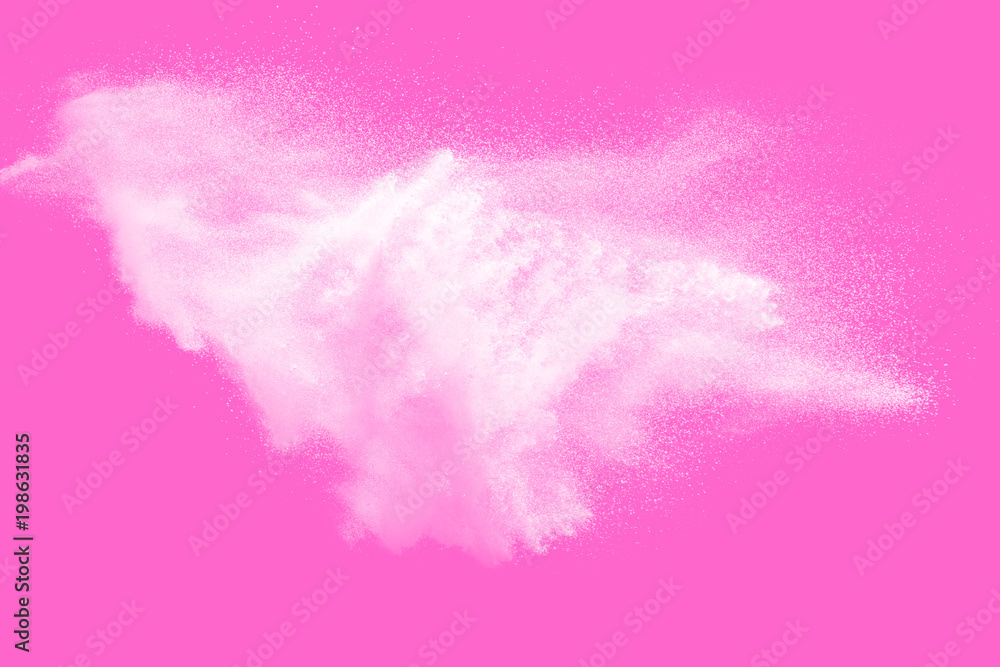 Abstract white color powder explosion on pink background. Freeze motion of white powder splashing.