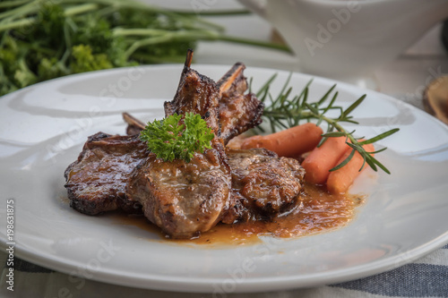 lamb steak on white plate
