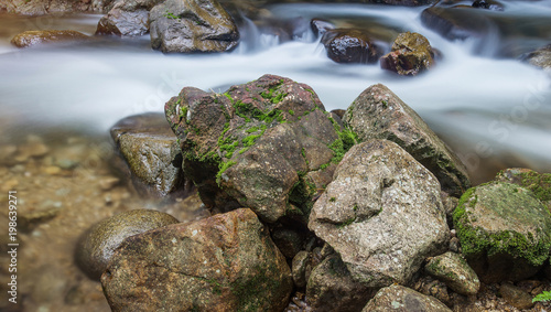 The stream flows from the waterfall. A water route through rocks