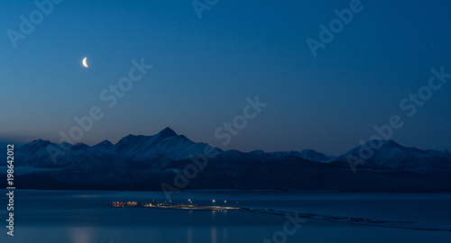 Moon over Homer Spit on near cloudless night