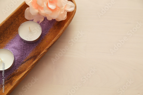 Beautiful composition of spa treatment on white wooden table . spa concept with bath salt .