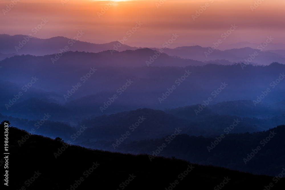 layer mountains in the evening in the tropical rainforest of Thailand layer mountains in the evening in the tropical rainforest of Thailand