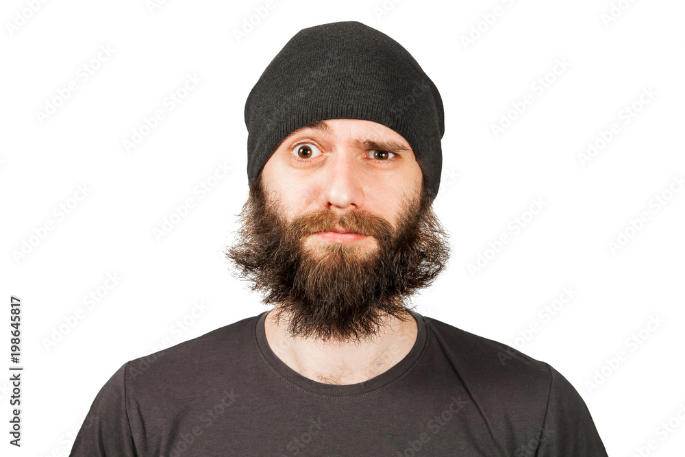 Young bearded man in hat winking. Isolated on white. Young bearded man in hat winking. Isolated on white.