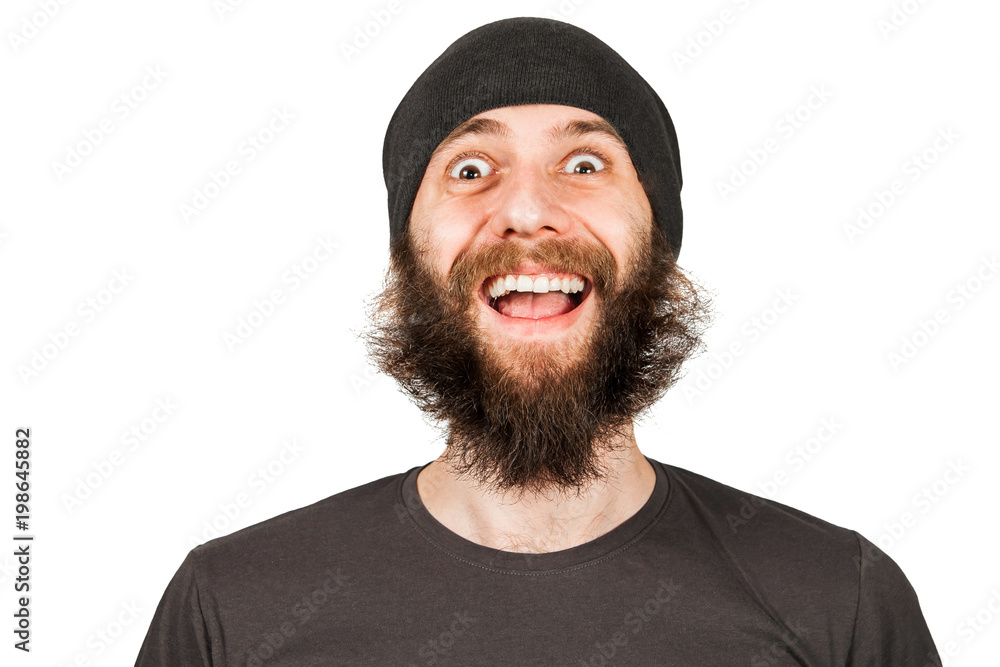 Young funny guy with beard in hat laughs. Isolated on white. Young funny guy with beard in hat laughs. Isolated on white.