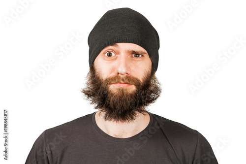 Young bearded man in hat winking. Isolated on white. © vika33