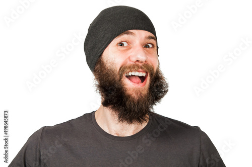Young funny guy with beard in hat laughs. Isolated on white.