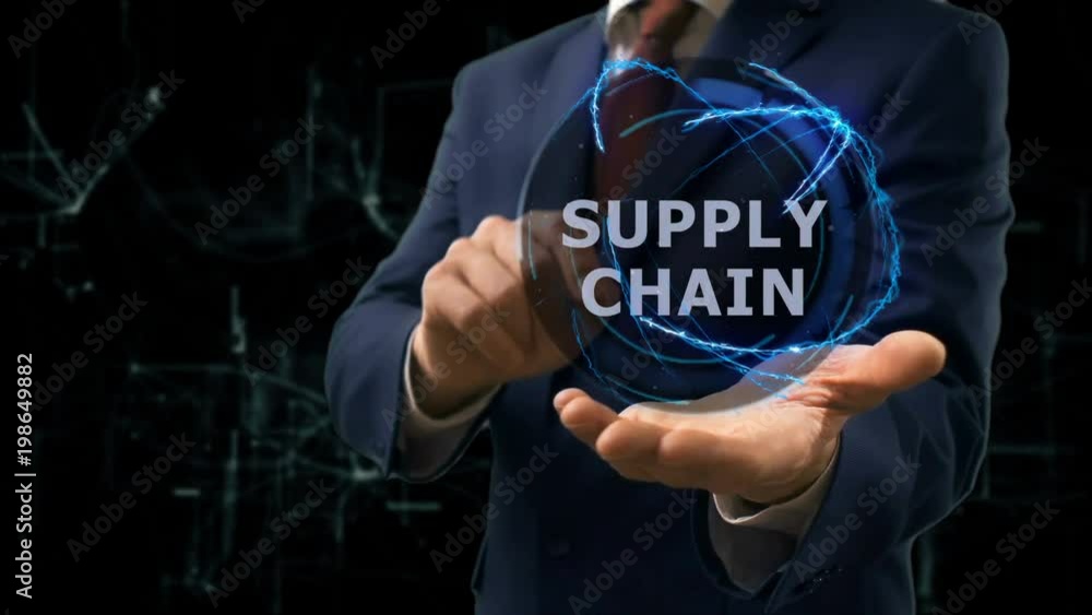 Businessman shows concept hologram Supply Chain on his hand. Man in business suit with future technology screen and modern cosmic background Businessman shows concept hologram Supply Chain on his hand. Man in business suit with future technology screen and modern cosmic background