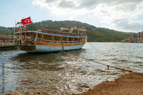 A tourist yacht stands near the shore. Near the beach Maiden Spit. Turkey