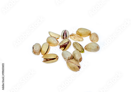 Salted pistachio nuts on white background