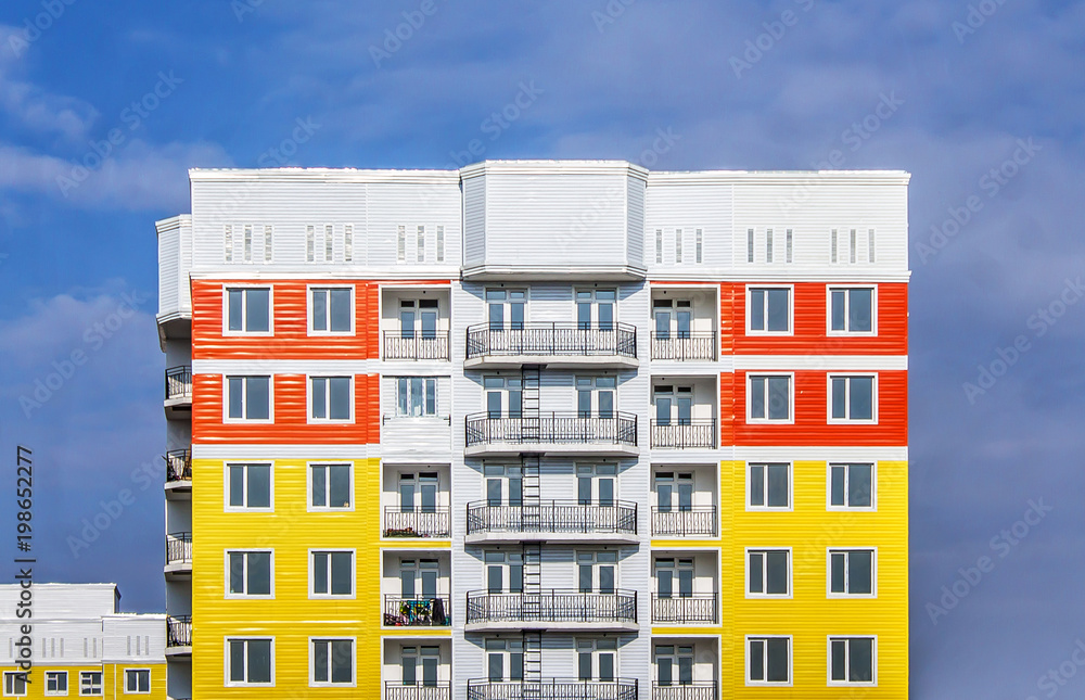 Bright high-rise house against the sky as a background
