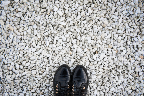 Shoes on a background of white stones