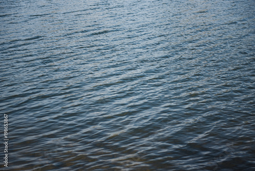 Fast river water background with waves and ripple pattern